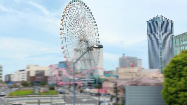 Yokohama Cosmo World amusement park features the iconic Cosmo Clock 21 ferris wheel in Japan. This massive tourist attraction stands 112.5 meters tall with a diameter of 100 meters.