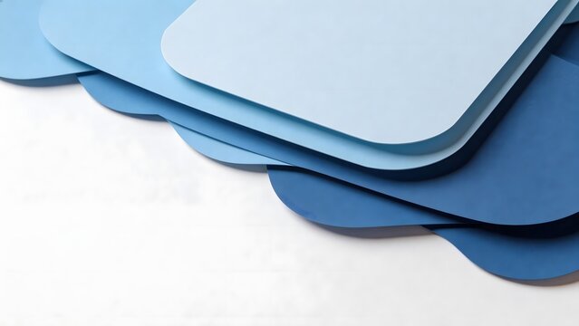 Stack of blue paper cutouts on white surface