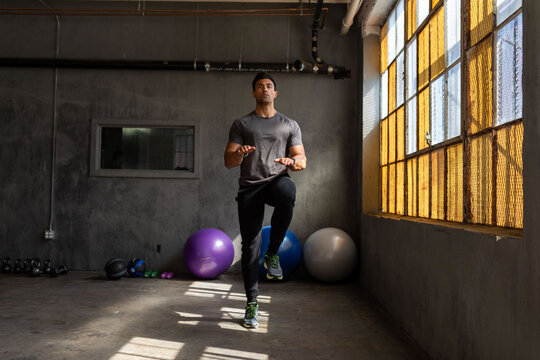Man exercising in industrial gym