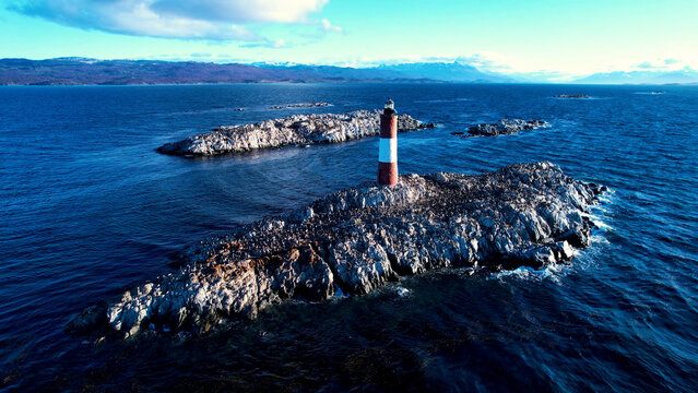 Sunset Lighthouse In Ushuaia Tierra Del Fuego Argentina. Iconic Structure Of The Historic Lighthouse In A Coastal City. Outdoor Travel Destinations Patagonia Golden Hour.