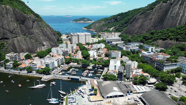 Harbor Pier In Urca Rio De Janeiro Brazil. Breathtaking Aerial View Of A Lush Tropical Coastline Scenery. Shore Horizon Beach Sea. Shore Seaside Tropical Environment. Urca Rio de Janeiro.