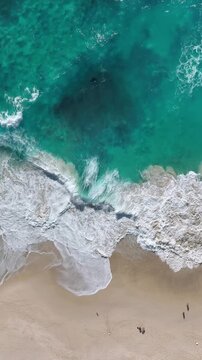 Aerial view of Kelingking Beach in Nusa Penida island, Bali in Indonesia. Vertical