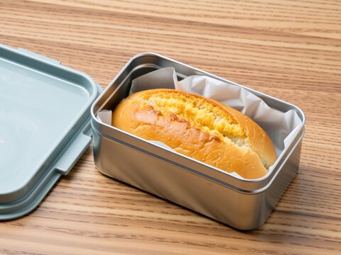Preparing a simple bread roll for school lunch