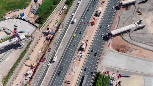 Aerial View of HS2 Railway Construction Works and Viaduct Spans Crossing the M42 Motorway Traffic in Coleshill UK
