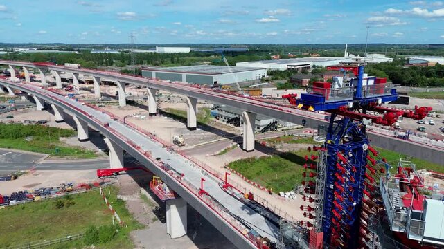 Aerial View of HS2 Railway Construction Works and Viaduct Spans Crossing the M42 Motorway Traffic in Coleshill UK