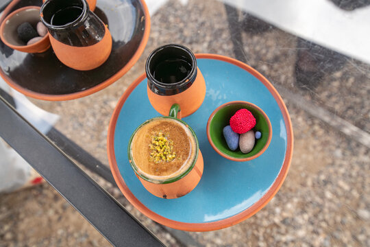 Turkish coffee served on the street in a clay pot