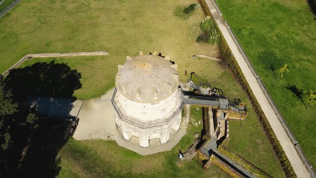 Drone view of the Mausoleum of Theodoric in Ravenna, Emilia-Romagna, Italy, showing the historic circular stone monument from above.