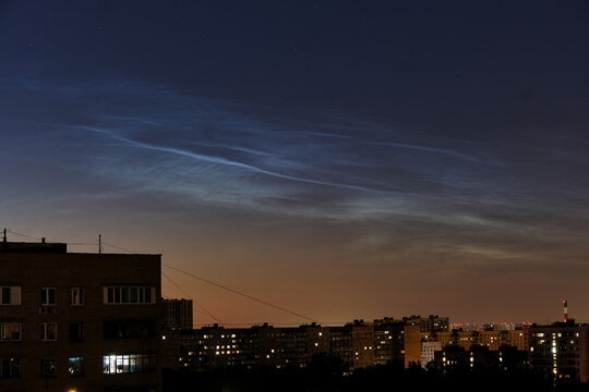 Night Cityscape with Rare Noctilucent Clouds Over Apartment Buildings