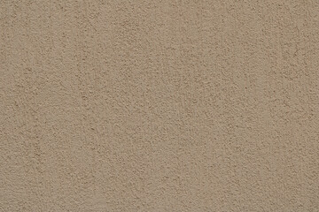Obraz premium Textured Beige–Grey Plaster Wall Background. Warm beige and earthy grey scratched‑plaster wall texture with subtle brownish tones, ideal as a natural background.
