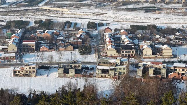 Snow Covered Rural Village and Farmland in Winter