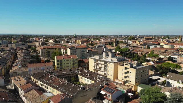 Wide drone panorama of Ravenna, Emilia-Romagna, Italy, showing the historic city center and urban skyline under clear blue sky.