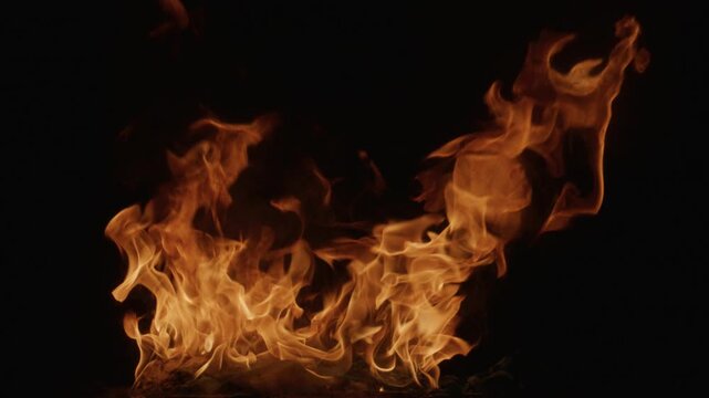 Burn effect pattern. Fire flames on black background. Burning fire slow motion. Blaze wallpaper. Abstract fire flame background. Fire flame texture.
