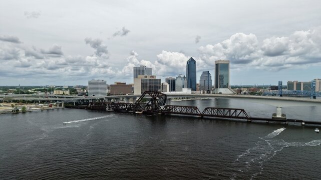 Aerial view of the Northbank Riverwalk Brooklyn and Jacksonville skyline with the FEC Strauss Trunnion Bascule Bridge over the St. Johns River Jacksonville, Florida, United States.