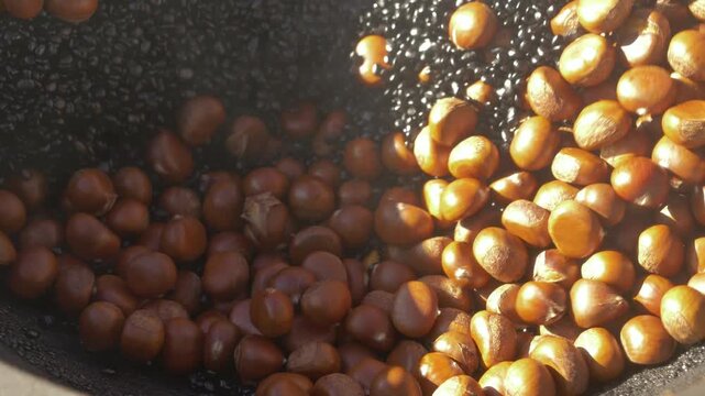 Roasted Chestnuts Cooking in Hot Pan