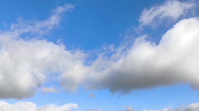 Shadowed big altocumulus clouds in the blue sky