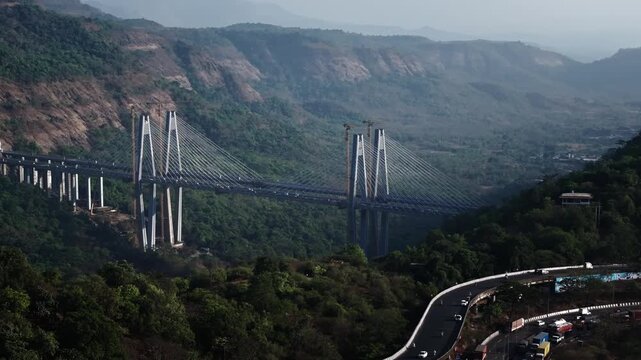 A stunning aerial view of the Mumbai-Pune Missing Link, showcasing one of India&rsquo;s most ambitious expressway projects, cutting through scenic hills and valleys.