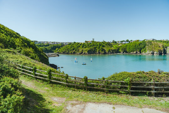 Coastal walking path overlooking harbor in Fishguard Wales