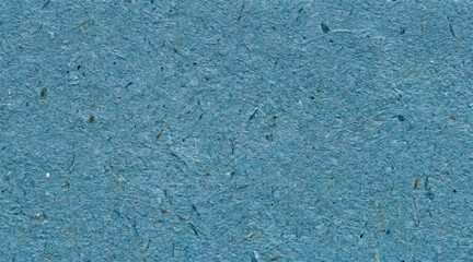 Fototapeta premium Blue recycled paper texture background featuring organic fibers and rough handcrafted surface details