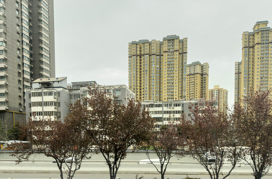 High rise residential towers in Baqiao District Xian beneath overcast spring city sky, China