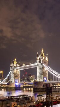 Time Lapse of the Tower Bridge over the River Thames in London at Night. Vertical Video.