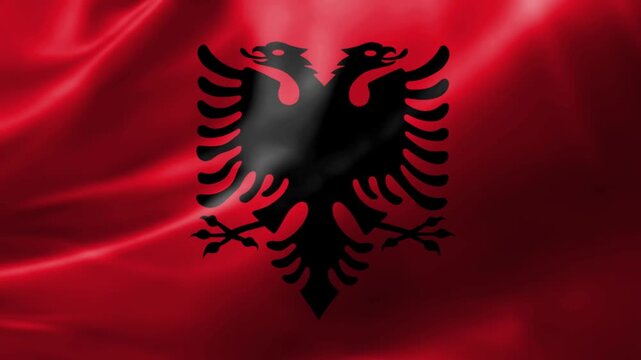 Albanian Flag Waving with Black Double-Headed Eagle Emblem on Red Background
