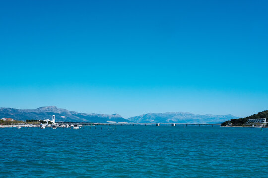 Expansive clear blue sky over the deep blue Adriatic Sea