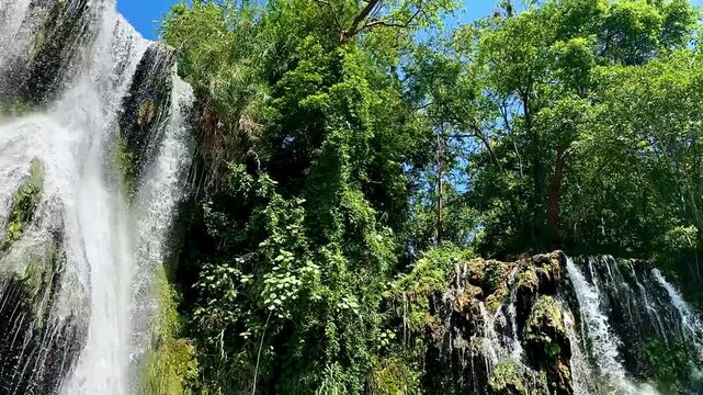 Pan Across Tropical Waterfalls and Jungle Cliffs (Tamasopo, San Luis Potosi, Mexico)