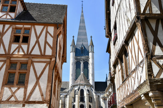 Apse and Steeple of Notre-Dame of Dijon, France with Half-Timbered Buildings on Left and Right