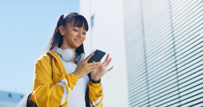 Happy girl, phone and city with social media on space for connection, network or student research. Teenager, youth or user scrolling with smile on mobile smartphone for communication, app or chat