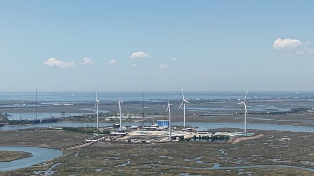 Drone aerial view of a wind turbine electric generating farm
