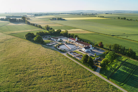  Aerial view of modern industrial sewage treatment plant at sunrise.