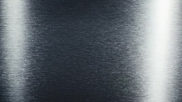 Close-up macro shot of a brushed metal surface with a bright vertical light reflection creating a textured metallic background with horizontal lines Keywords: brushed metal, texture, metallic