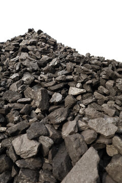 Dark coal piles form a rough mound