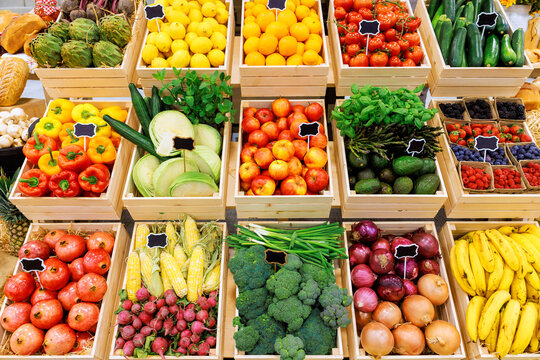 Stalls vibrant fruits vegetables in rustic farm market, inviting shoppers to explore fresh produce.