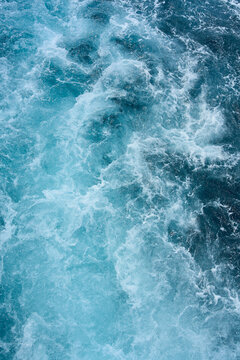 Blue sea water with spray