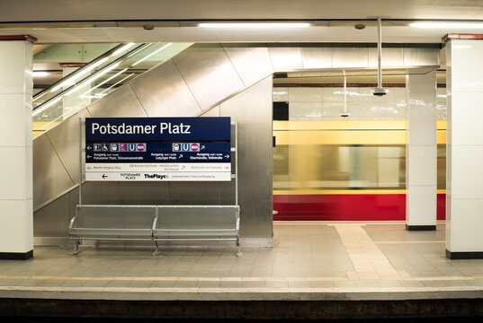 Berlin, Germany: Potsdamer Platz subway station with train passing