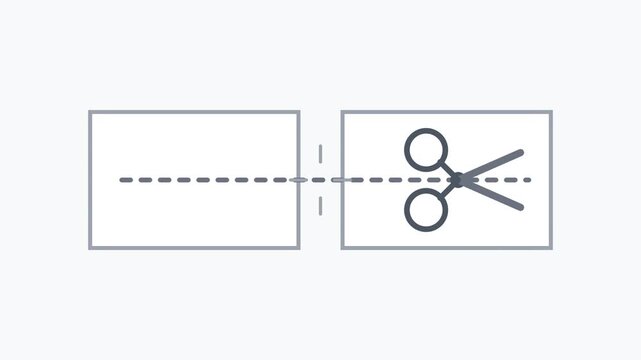 Scissors cut through a dashed line between two rectangles on a table indoors closeup.