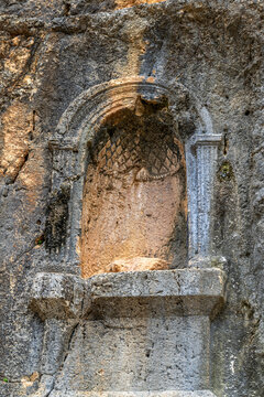 Niche carved in the rock cliff wall at the Temple of Pan at Banias Nature Reserve in northern Israel on a rainy Winter's day.
