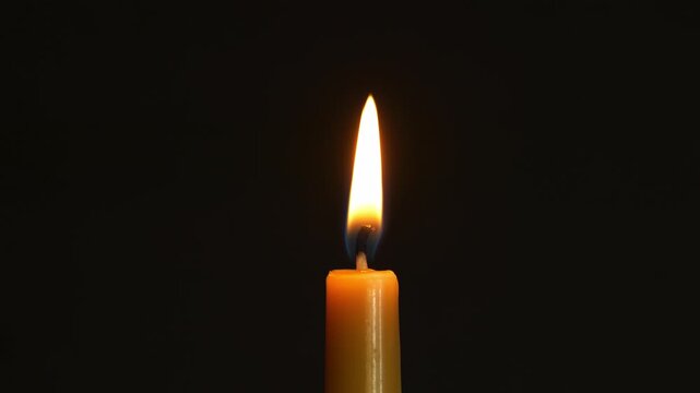 A candle being blown out in slow motion