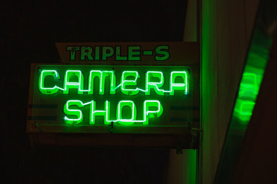 Neon sign for Triple S Camera, first opened in 1949. Ukiah, California, October 2019