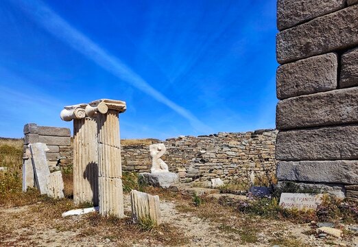 Photo of the ruins of the Maison de Granit (&ldquo;House of Granite&rdquo;), a distinctive ancient structure on the sacred island of Delos, Greece. 