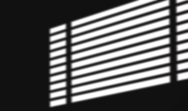Black and white horizontal blind stripe shadow light beam on dark background