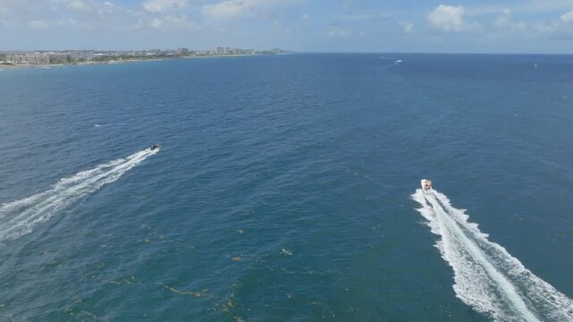 drone view of boats in ocean
