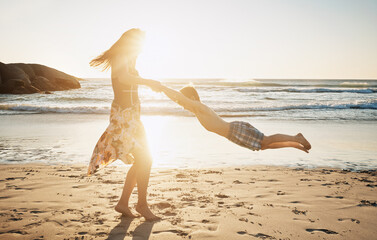 Vacation, mom and child with spinning at beach for fun game, summer trip and connection. Energy,...