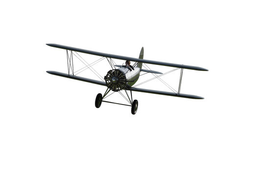 Isolated classic vintage biplane flying with pilot, historical propeller aircraft in motion