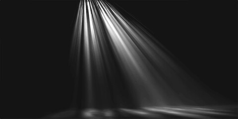 Dramatic spotlights cut through the darkness, casting beams of light onto a reflective surface, creating a striking visual effect of illuminated space. © jaduuu