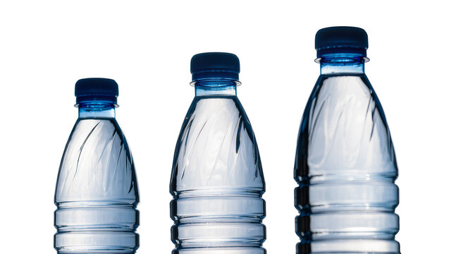 Isolated water bottles arranged by size, plastic containers with blue caps for hydration.