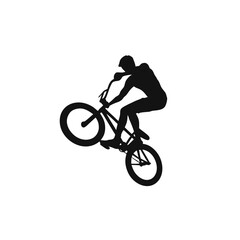 Naklejka premium BMX Rider Silhouette: A dynamic silhouette of a BMX rider performing a stunt on a bicycle, capturing the essence of extreme sports and athletic skill.