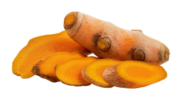 Isolated fresh turmeric root and vibrant orange sliced pieces, aromatic healthy spice.