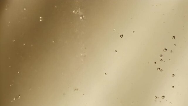 Cinematic Champagne Beige Liquid Abstract Background Loop with Slow Motion Rising Bubbles and Warm Pale Gradient